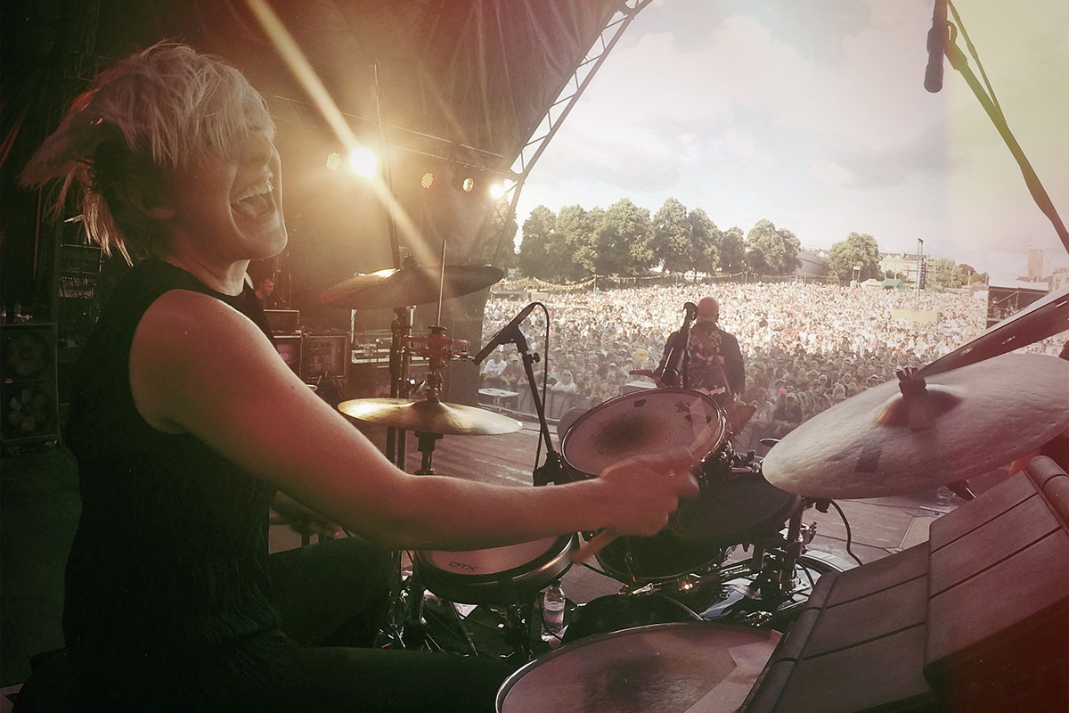 Emily Dolan performing on drums